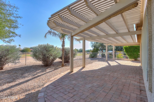 view of patio / terrace with a pergola and fence