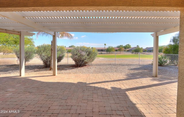 view of patio / terrace featuring a pergola and fence