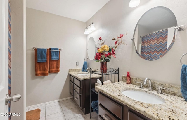 7457 W Crystal Rd, Glendale, AZ 85308 - bathroom with baseboards, tile patterned floors, two vanities, and a sink