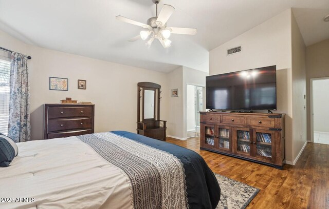 7457 W Crystal Rd, Glendale, AZ 85308 - bedroom with vaulted ceiling, baseboards, visible vents, and wood finished floors