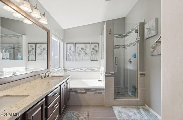 7457 W Crystal Rd, Glendale, AZ 85308 - bathroom featuring double vanity, a sink, a bath, a shower stall, and lofted ceiling