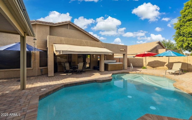 7457 W Crystal Rd, Glendale, AZ 85308 - view of swimming pool with a patio area, a hot tub, a fenced in pool, and a fenced backyard