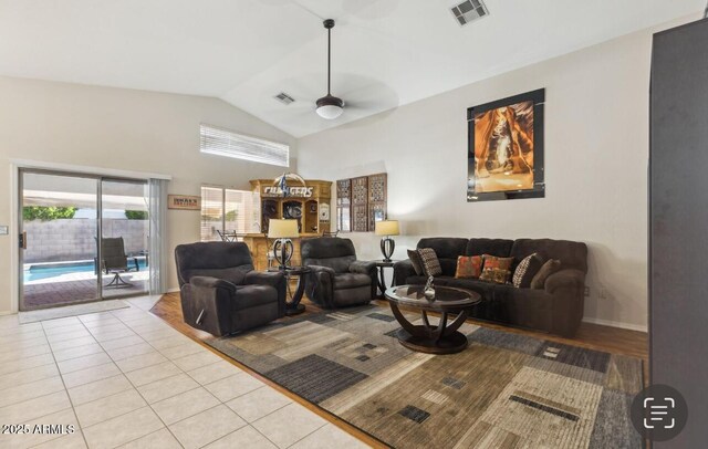 7457 W Crystal Rd, Glendale, AZ 85308 - living area featuring light tile patterned floors, visible vents, a ceiling fan, and a healthy amount of sunlight