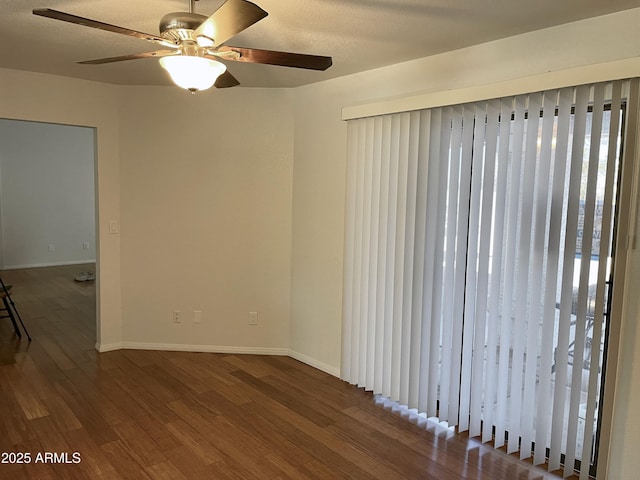 unfurnished room with hardwood / wood-style floors and a textured ceiling