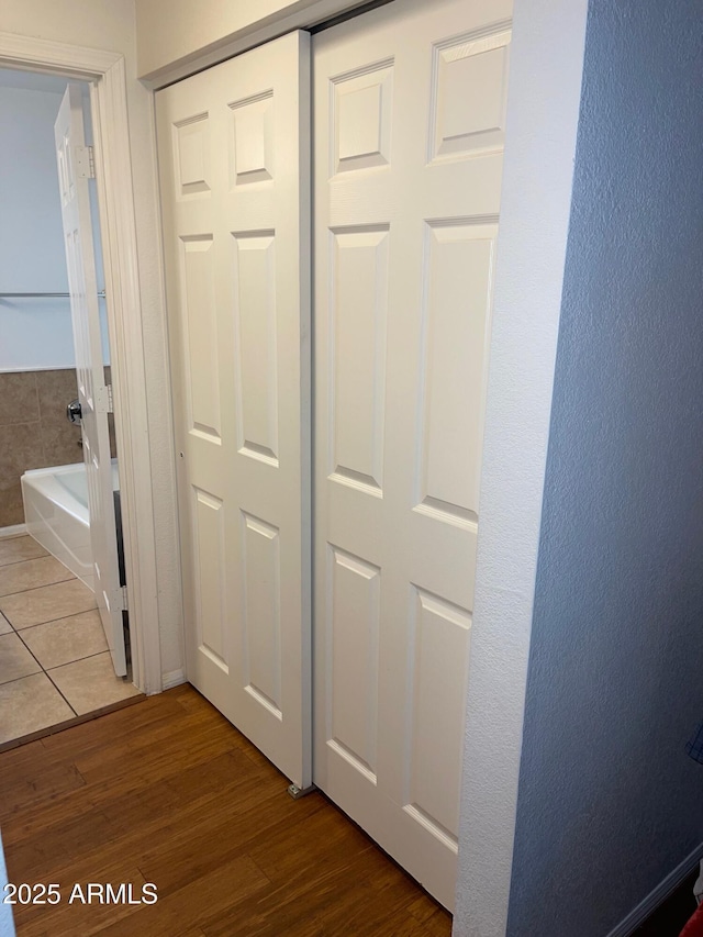 corridor with wood-type flooring