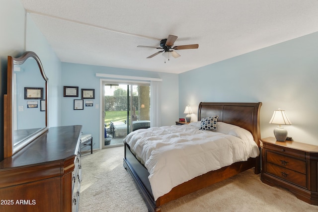 bedroom featuring ceiling fan, access to exterior, and light carpet