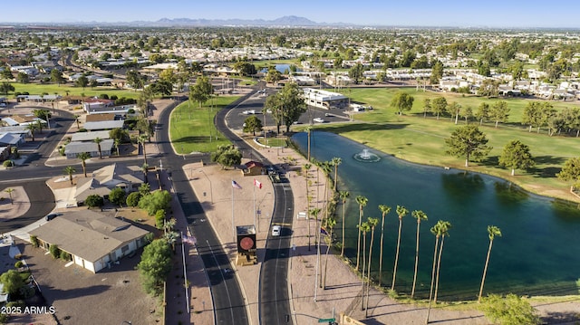 drone / aerial view featuring a water and mountain view