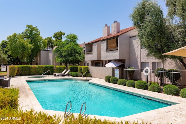 view of swimming pool featuring a patio