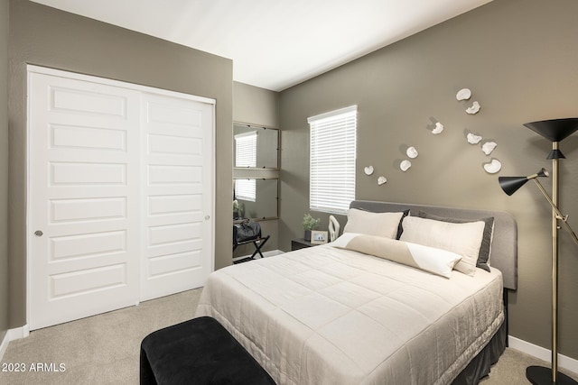 carpeted bedroom featuring a closet