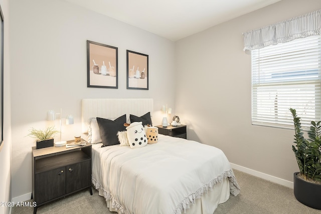 bedroom with light colored carpet