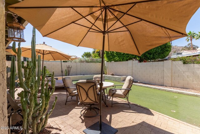 9012 S 47th Pl, Phoenix, AZ 85044 - view of patio with a fenced backyard and outdoor dining area