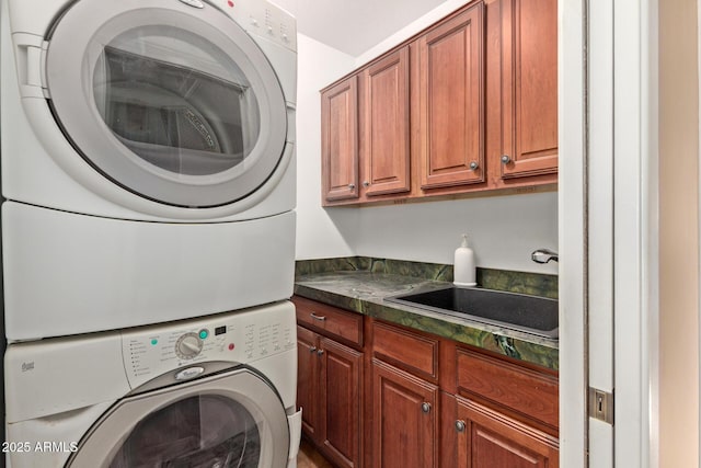 9012 S 47th Pl, Phoenix, AZ 85044 - clothes washing area with a sink, stacked washing maching and dryer, and cabinet space