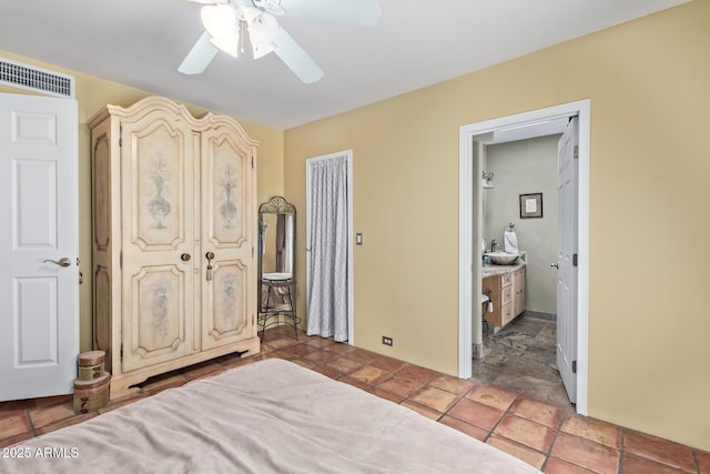 9012 S 47th Pl, Phoenix, AZ 85044 - bedroom featuring stone finish flooring, ensuite bath, a ceiling fan, and visible vents