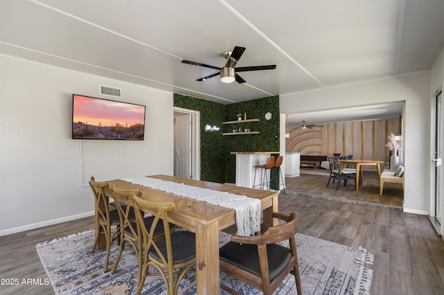 4904 E Tierra Buena Ln, Scottsdale, AZ 85254 - dining room featuring visible vents, baseboards, a ceiling fan, and wood finished floors