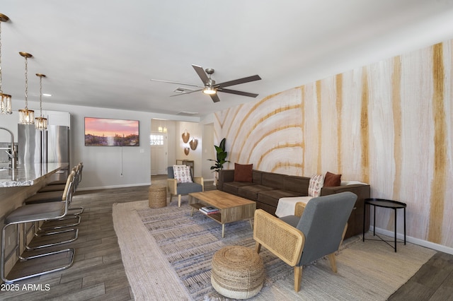 4904 E Tierra Buena Ln, Scottsdale, AZ 85254 - living area with ceiling fan, baseboards, and dark wood-style flooring
