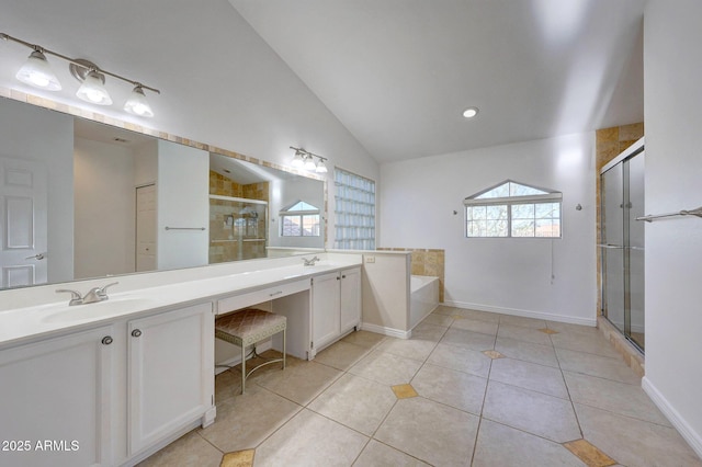 bathroom with plus walk in shower, tile patterned flooring, vanity, and lofted ceiling