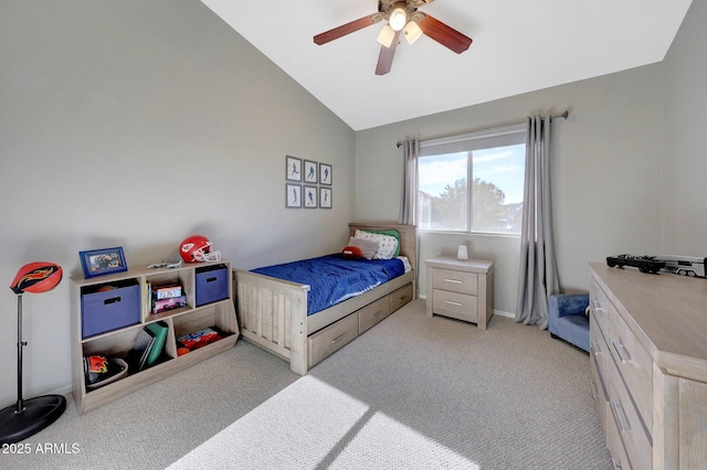 carpeted bedroom with lofted ceiling and ceiling fan