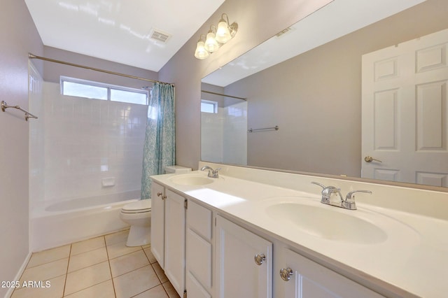 full bathroom featuring tile patterned floors, vanity, toilet, and shower / tub combo