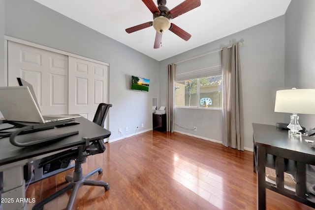 office space with ceiling fan, lofted ceiling, and wood-type flooring