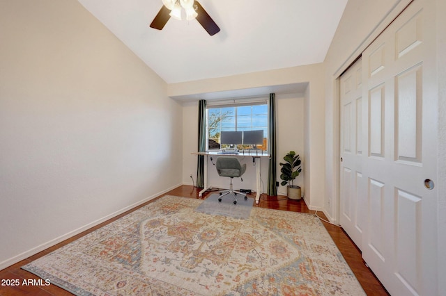 office with vaulted ceiling and dark hardwood / wood-style flooring