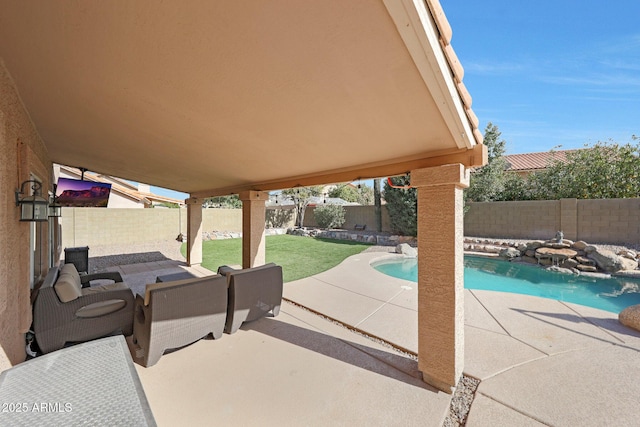 view of patio featuring a fenced in pool