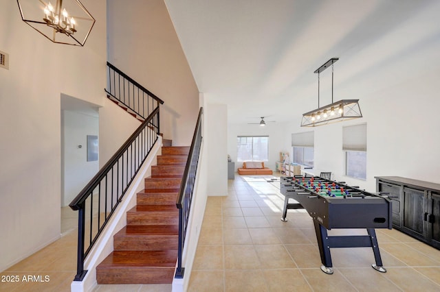 playroom with light tile patterned floors and ceiling fan