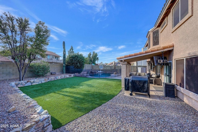 view of yard featuring a patio and a fenced in pool