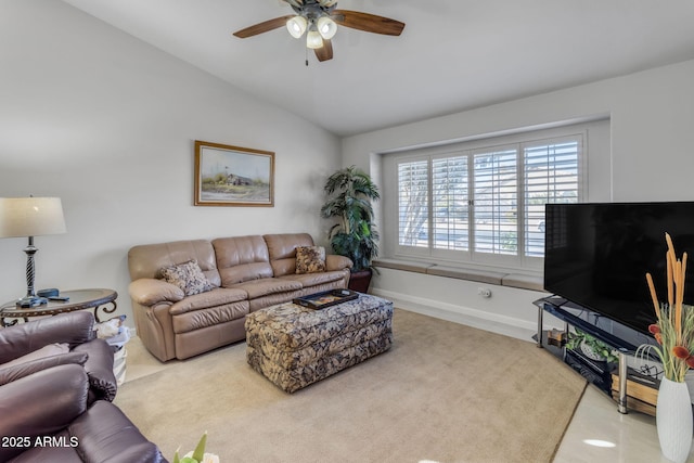 living room with ceiling fan and lofted ceiling