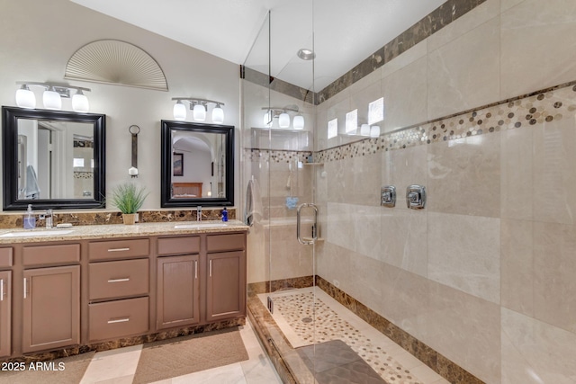 bathroom with vanity and an enclosed shower