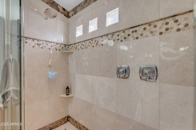 bathroom featuring tiled shower