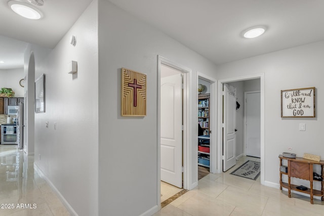 hallway with light tile patterned floors