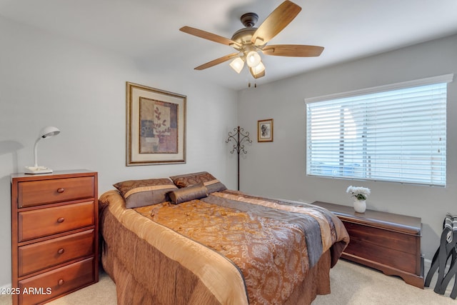 bedroom featuring light colored carpet and ceiling fan