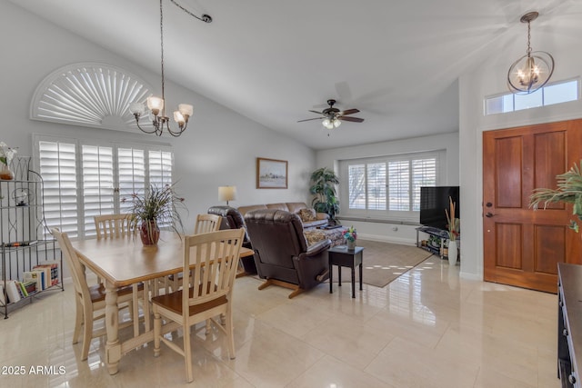 dining area with vaulted ceiling and ceiling fan with notable chandelier