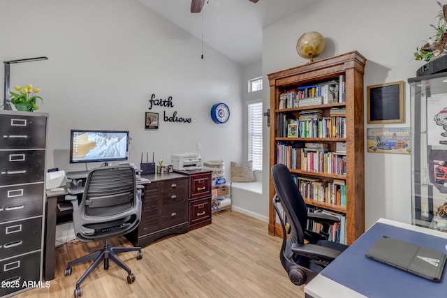 home office featuring ceiling fan, high vaulted ceiling, and light wood-type flooring