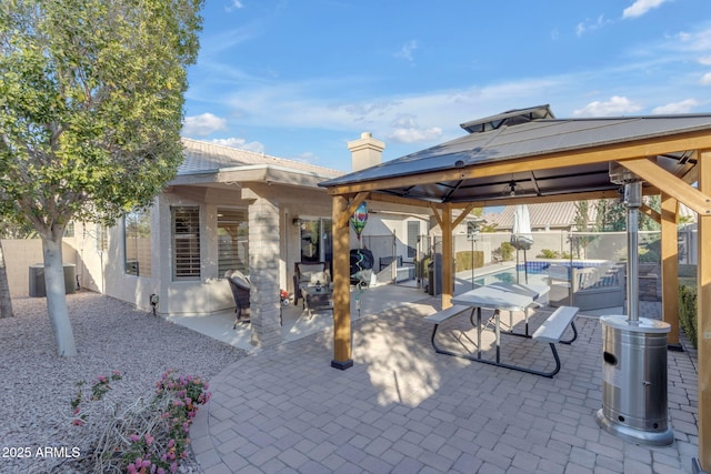 view of patio with a fenced in pool, a gazebo, and central AC