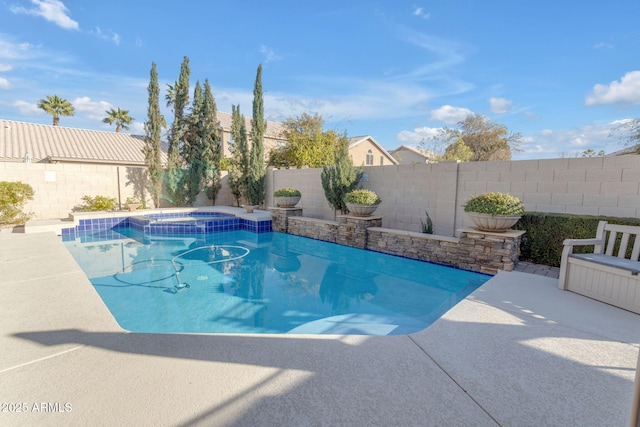 view of swimming pool with a patio area and an in ground hot tub