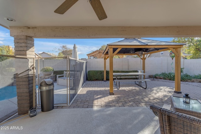 view of patio with a gazebo and ceiling fan