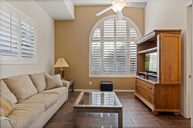 living room with ceiling fan and a healthy amount of sunlight