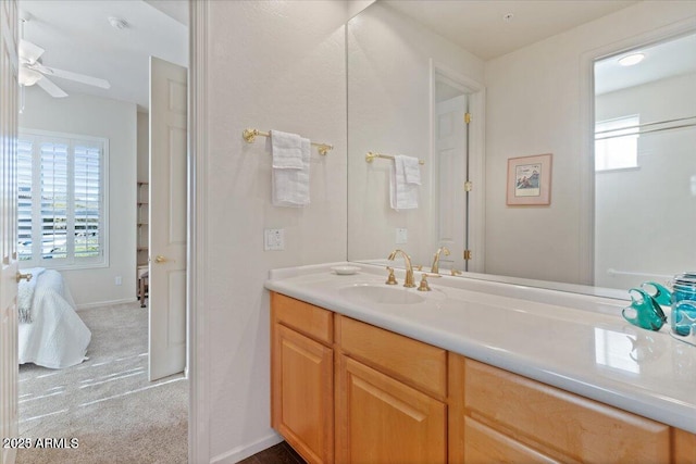 bathroom featuring ceiling fan and vanity