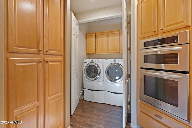 clothes washing area featuring independent washer and dryer and dark hardwood / wood-style flooring