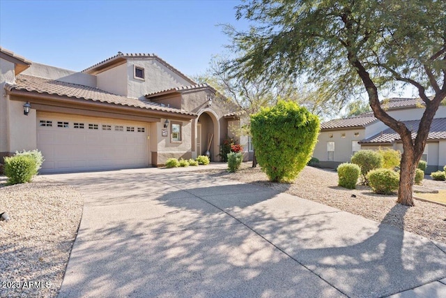 mediterranean / spanish-style home featuring a garage