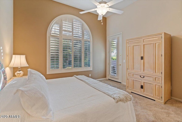 carpeted bedroom with access to exterior and ceiling fan