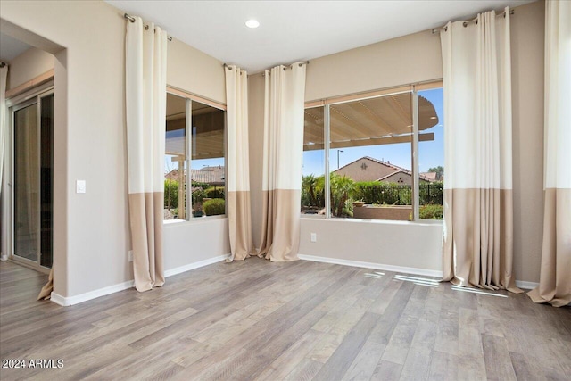 spare room with light wood-type flooring