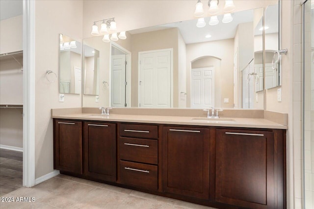 bathroom with tile patterned flooring and vanity