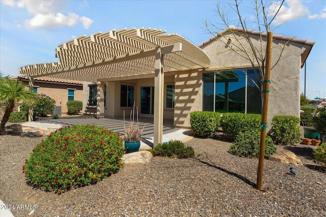 back of house with a patio and a pergola