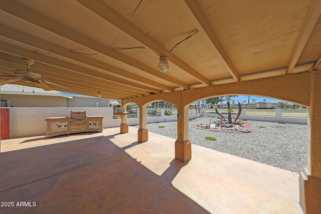 view of patio / terrace featuring fence