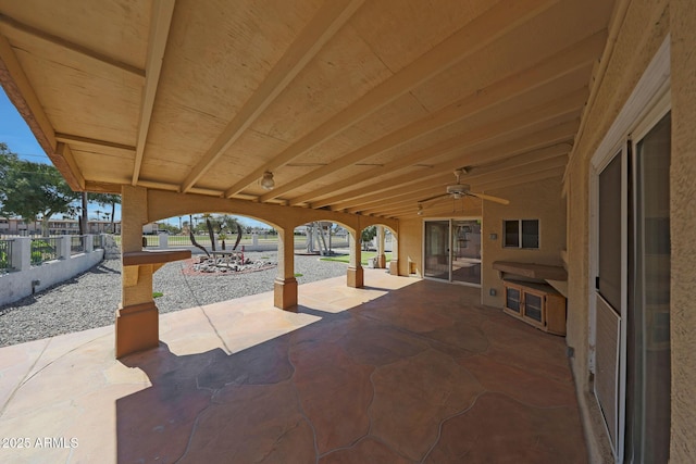 view of patio / terrace featuring a ceiling fan and fence