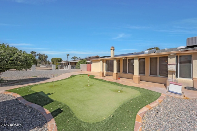 view of yard with cooling unit, a patio, and fence private yard