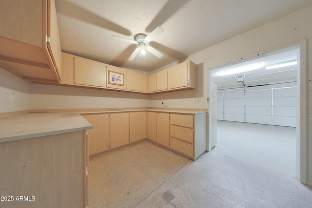 kitchen featuring ceiling fan, light brown cabinetry, and light countertops