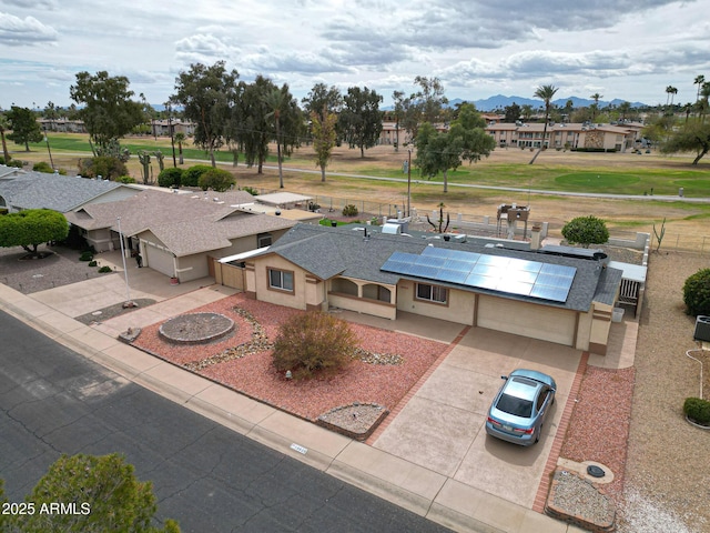 birds eye view of property with a mountain view and a residential view